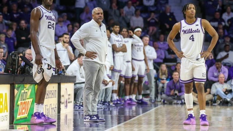 Feb 17, 2024; Manhattan, Kansas, USA; Kansas State Wildcats head coach Jerome Tang, forward Arthur Maluma (24) and guard Dai Dai Ames (4) watch as the TCU Horned Frogs shoots free throws during the second half at Bramlage Coliseum. Mandatory Credit: Scott Sewell-USA TODAY Sports
