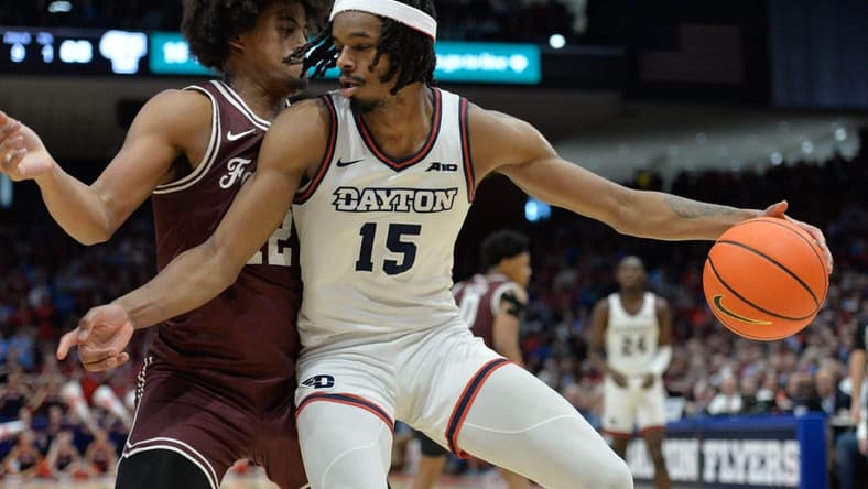 Feb 17, 2024; Dayton, Ohio, USA; Dayton Flyers forward DaRon Holmes II (15) is fouled by Fordham Rams forward Elijah Gray (12) during a game at University of Dayton Arena. Mandatory Credit: Matt Lunsford-USA TODAY Sports