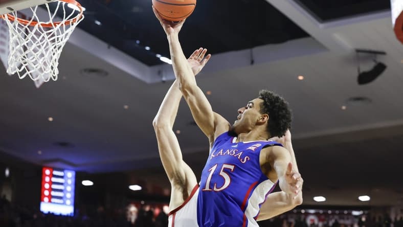 Feb 17, 2024; Norman, Oklahoma, USA; Kansas Jayhawks guard Kevin McCullar Jr. (15) goes to the basket against the Oklahoma Sooners during the first half at Lloyd Noble Center. Mandatory Credit: Alonzo Adams-USA TODAY Sports