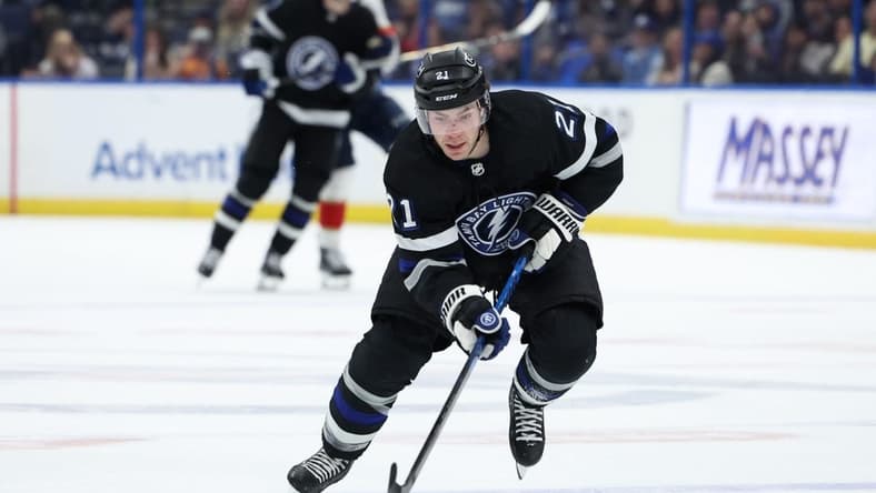 Feb 17, 2024; Tampa, Florida, USA; Tampa Bay Lightning center Brayden Point (21) controls the puck against the Florida Panthers in the third period at Amalie Arena. Mandatory Credit: Nathan Ray Seebeck-USA TODAY Sports