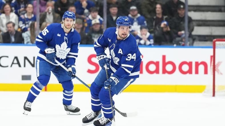 Feb 17, 2024; Toronto, Ontario, CAN; Toronto Maple Leafs center Auston Matthews (34) skates with the puck against the Anaheim Ducks during the first period at Scotiabank Arena. Mandatory Credit: Nick Turchiaro-USA TODAY Sports