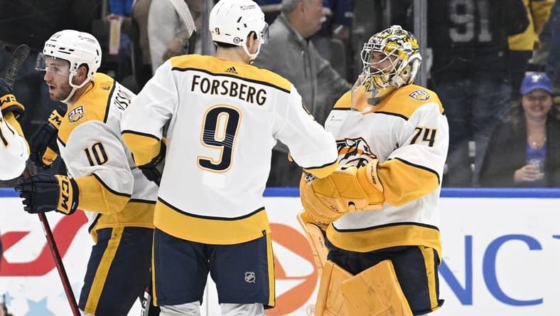 Feb 17, 2024; St. Louis, Missouri, USA; Nashville Predators left wing Filip Forsberg (9) congratulates goaltender Juuse Saros (74) after defeating the St. Louis Blues at Enterprise Center. Mandatory Credit: Jeff Le-USA TODAY Sports