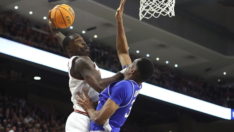 Feb 17, 2024; Auburn, Alabama, USA; Auburn Tigers forward Jaylin Williams (2) goes up against Kentucky Wildcats forward Ugonna Onyenso (33) for a shot during the second half at Neville Arena. Mandatory Credit: John Reed-USA TODAY Sports