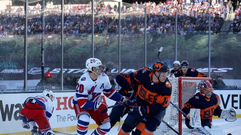 Feb 18, 2024; East Rutherford, New Jersey, USA; New York Islanders goaltender Ilya Sorokin (30) plays the puck against New York Rangers left wing Chris Kreider (20) during the first period of a Stadium Series ice hockey game at MetLife Stadium. Mandatory Credit: Brad Penner-USA TODAY Sports