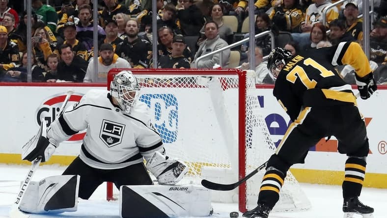 Feb 18, 2024; Pittsburgh, Pennsylvania, USA; Los Angeles Kings goaltender Cam Talbot (39) makes a save against Pittsburgh Penguins center Evgeni Malkin (71) during the first period at PPG Paints Arena. Mandatory Credit: Charles LeClaire-USA TODAY Sports