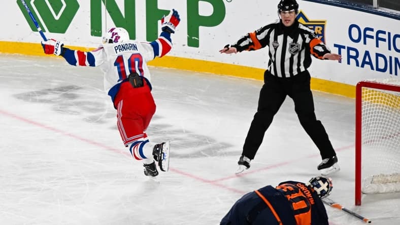 Feb 18, 2024; East Rutherford, New Jersey, USA; New York Rangers left wing Artemi Panarin (10) celebrates his game winning goal against the New York Islanders during the overtime period in a Stadium Series ice hockey game at MetLife Stadium. Mandatory Credit: Dennis Schneidler-USA TODAY Sports
