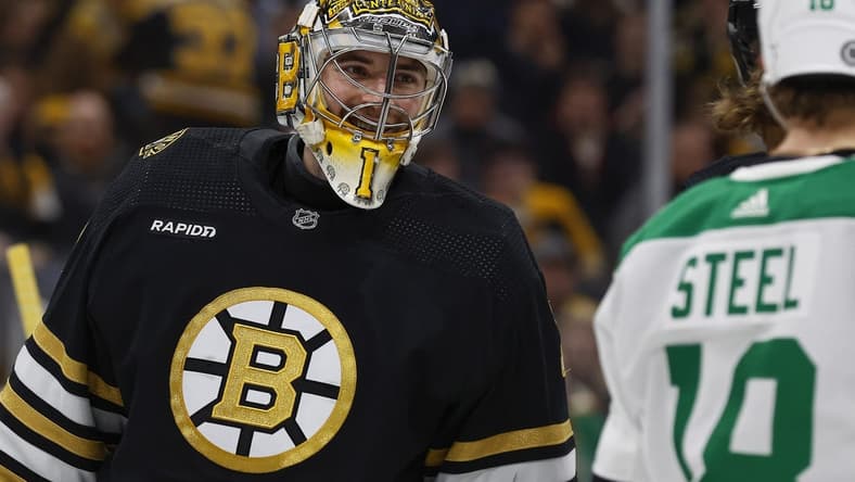 Feb 19, 2024; Boston, Massachusetts, USA; Boston Bruins goaltender Jeremy Swayman (1) smiles at Dallas Stars center Sam Steel (18) during the second period at TD Garden. Mandatory Credit: Winslow Townson-USA TODAY Sports