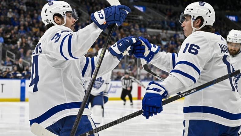 Feb 19, 2024; St. Louis, Missouri, USA;  Toronto Maple Leafs center Auston Matthews (34) celebrates with right wing Mitchell Marner (16) after scoring against the St. Louis Blues during the third period at Enterprise Center. Mandatory Credit: Jeff Curry-USA TODAY Sports