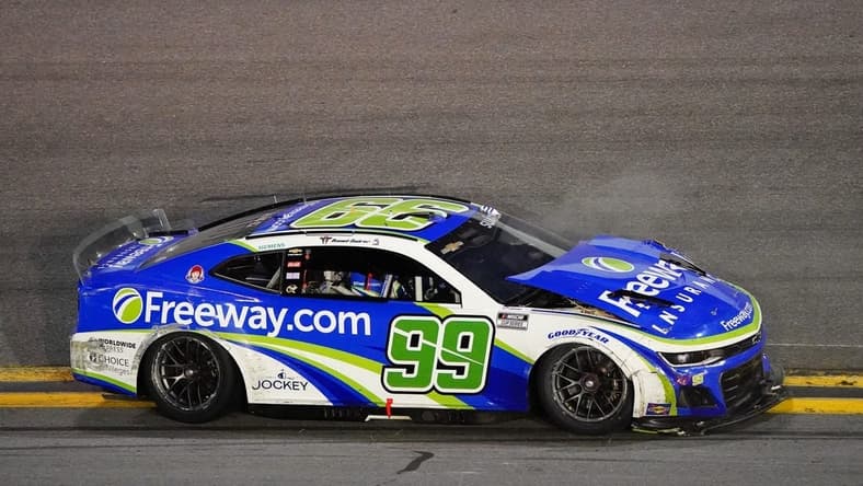 Feb 19, 2024; Daytona Beach, Florida, USA; NASCAR Cup Series driver Daniel Suarez (99) wrecks during the Daytona 500 at Daytona International Speedway. Mandatory Credit: John David Mercer-USA TODAY Sports