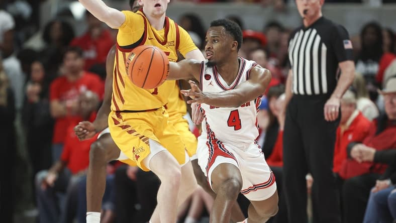 Feb 19, 2024; Houston, Texas, USA; Houston Cougars guard L.J. Cryer (4) passes the ball during the first half against the Iowa State Cyclones at Fertitta Center. Mandatory Credit: Troy Taormina-USA TODAY Sports