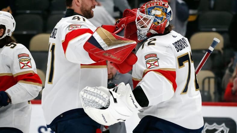 Feb 14, 2024; Pittsburgh, Pennsylvania, USA; Florida Panthers goaltenders Anthony Stolarz (41) and Sergei Bobrovsky (72) celebrate after defeating the Pittsburgh Penguins at PPG Paints Arena. Mandatory Credit: Charles LeClaire-USA TODAY Sports