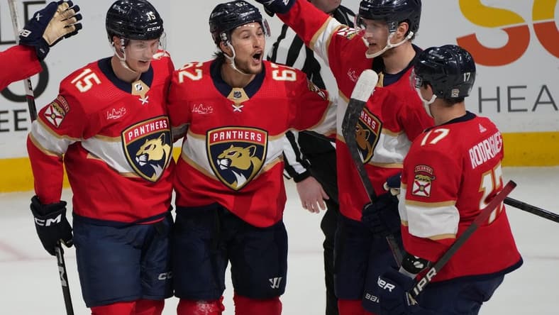 Feb 20, 2024; Sunrise, Florida, USA; Florida Panthers defenseman Brandon Montour (62) celebrates scoring a goal with teammates against the Ottawa Senators during the second period at Amerant Bank Arena. Mandatory Credit: Jim Rassol-USA TODAY Sports