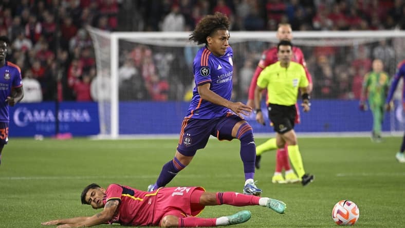 Feb 20, 2024; St. Louis, MO, USA; Houston Dynamo midfielder Adalberto Carrasquilla (20) dribbles past St. Louis City defender Anthony Markanich (13) during the first half of the CONCACAF Champions Cup-Round One at CITYPARK. Mandatory Credit: Joe Puetz-USA TODAY Sports