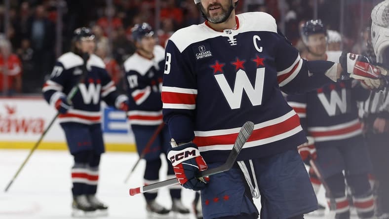 Feb 20, 2024; Washington, District of Columbia, USA; Washington Capitals left wing Alex Ovechkin (8) celebrates with teammates after scoring a goal against the New Jersey Devils in the third period at Capital One Arena. Mandatory Credit: Geoff Burke-USA TODAY Sports