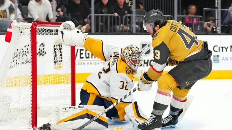 Feb 20, 2024; Las Vegas, Nevada, USA; Vegas Golden Knights center Paul Cotter (43) shoots against Nashville Predators goaltender Kevin Lankinen (32) during the second period at T-Mobile Arena. Mandatory Credit: Stephen R. Sylvanie-USA TODAY Sports