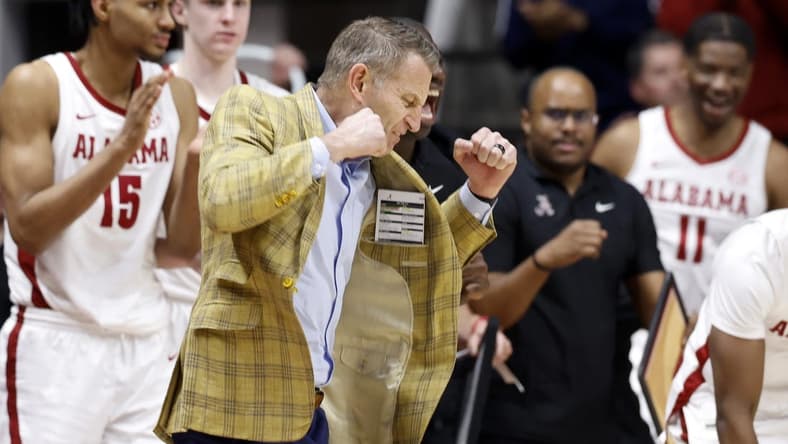 Feb 21, 2024; Tuscaloosa, Alabama, USA; Alabama Crimson Tide head coach Nate Oats reacts after a three pointer during overtime against the Florida Gators at Coleman Coliseum. Mandatory Credit: Butch Dill-USA TODAY Sports