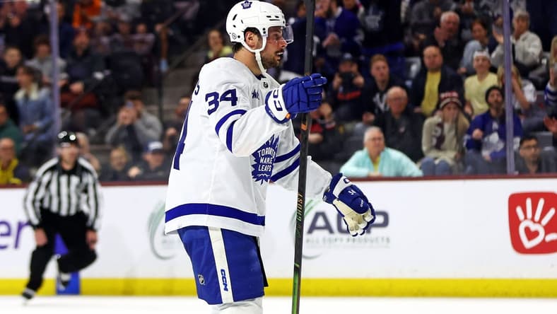 Feb 21, 2024; Tempe, Arizona, USA; Toronto Maple Leafs center Auston Matthews (34) celebrates after scoring a goal during the first period against the Arizona Coyotes at Mullett Arena. Mandatory Credit: Mark J. Rebilas-USA TODAY Sports