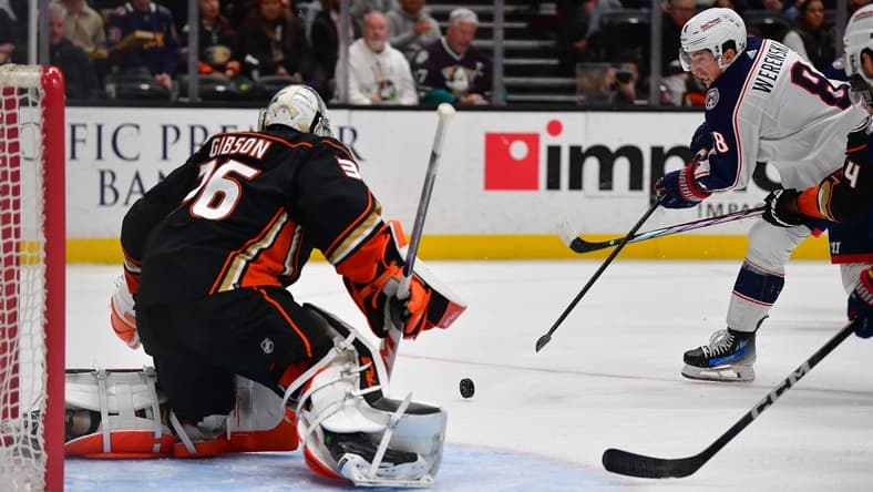 Feb 21, 2024; Anaheim, California, USA; Columbus Blue Jackets defenseman Zach Werenski (8) moves in for a shot on goal against Anaheim Ducks goaltender John Gibson (36) during the second period at Honda Center. Mandatory Credit: Gary A. Vasquez-USA TODAY Sports