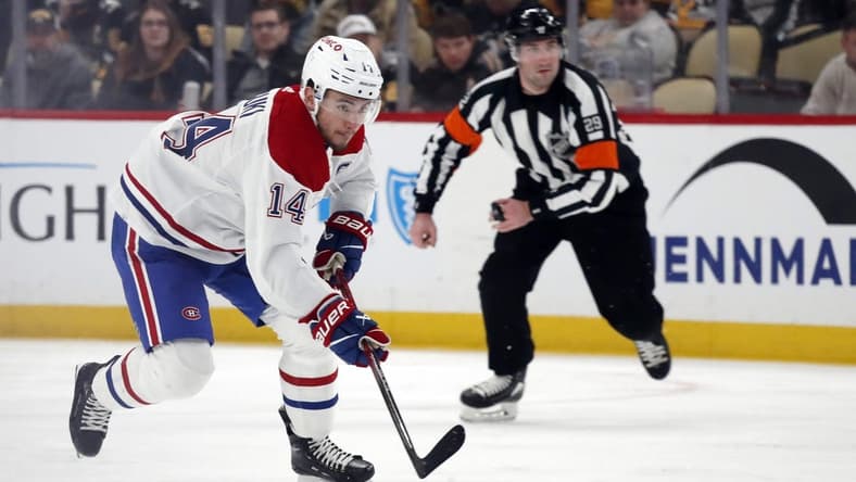 Feb 22, 2024; Pittsburgh, Pennsylvania, USA; Montreal Canadiens center Nick Suzuki (14) skates up ice with the puck against the Pittsburgh Penguins during the second period at PPG Paints Arena. Mandatory Credit: Charles LeClaire-USA TODAY Sports