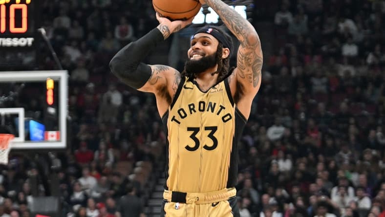 Feb 22, 2024; Toronto, Ontario, CAN; Toronto Raptors guard Gary Trent Jr. (33) shoots the ball against the Brooklyn Nets in the first half at Scotiabank Arena. Mandatory Credit: Dan Hamilton-USA TODAY Sports