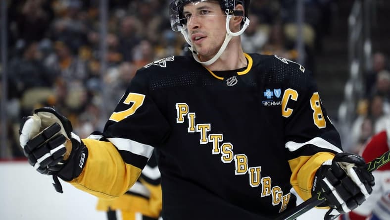 Feb 22, 2024; Pittsburgh, Pennsylvania, USA; Pittsburgh Penguins center Sidney Crosby (87) reacts on the ice against the Montreal Canadiens during the third period at PPG Paints Arena. The Penguins won 4-1. Mandatory Credit: Charles LeClaire-USA TODAY Sports