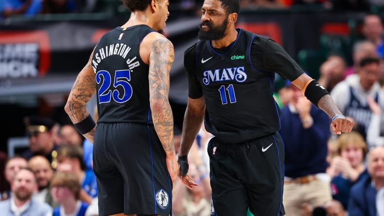 Feb 22, 2024; Dallas, Texas, USA; Dallas Mavericks guard Kyrie Irving (11) celebrates with Dallas Mavericks forward P.J. Washington (25) during the second half against the Phoenix Suns at American Airlines Center. Mandatory Credit: Kevin Jairaj-USA TODAY Sports