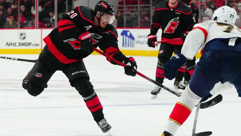 Feb 22, 2024; Raleigh, North Carolina, USA; Carolina Hurricanes center Sebastian Aho (20) takes a shot against the Florida Panthers during the third period at PNC Arena. Mandatory Credit: James Guillory-USA TODAY Sports