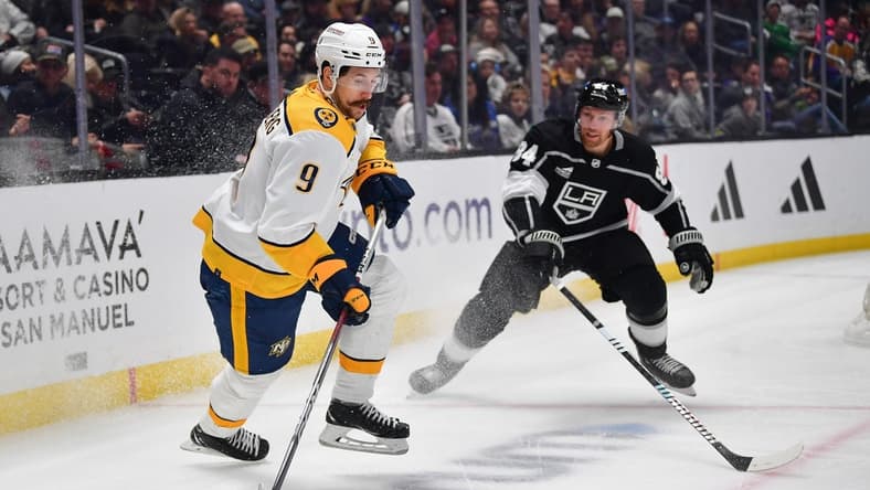 Feb 22, 2024; Los Angeles, California, USA; Nashville Predators left wing Filip Forsberg (9) controls the puck against Los Angeles Kings defenseman Vladislav Gavrikov (84) during the first period at Crypto.com Arena. Mandatory Credit: Gary A. Vasquez-USA TODAY Sports