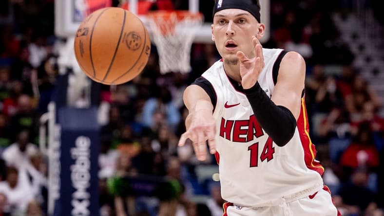 Feb 23, 2024; New Orleans, Louisiana, USA; Miami Heat guard Tyler Herro (14) passes the ball against the New Orleans Pelicans during the first half at Smoothie King Center. Mandatory Credit: Stephen Lew-USA TODAY Sports