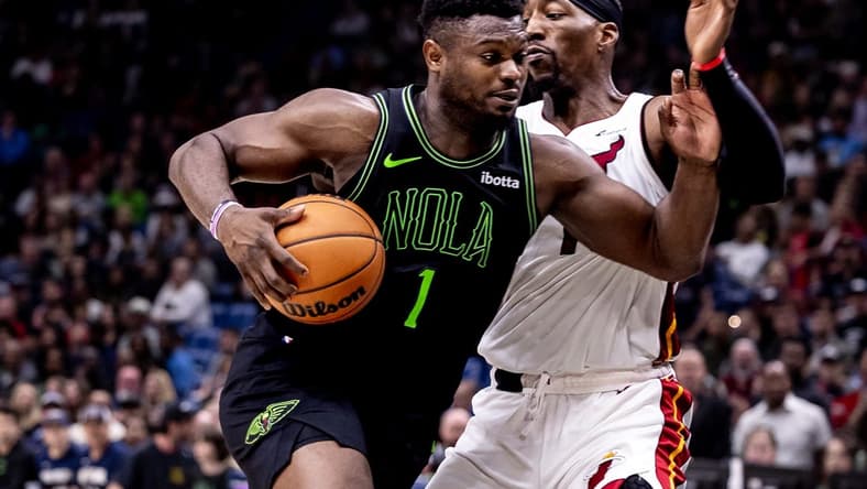 Feb 23, 2024; New Orleans, Louisiana, USA; New Orleans Pelicans forward Zion Williamson (1) drives to the basket against Miami Heat center Bam Adebayo (13) during the second half at Smoothie King Center. Mandatory Credit: Stephen Lew-USA TODAY Sports