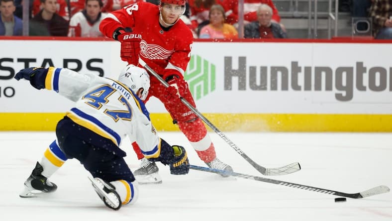 Feb 24, 2024; Detroit, Michigan, USA;  Detroit Red Wings right wing Patrick Kane (88) skates with the puck defended by St. Louis Blues defenseman Torey Krug (47) in the third period at Little Caesars Arena. Mandatory Credit: Rick Osentoski-USA TODAY Sports
