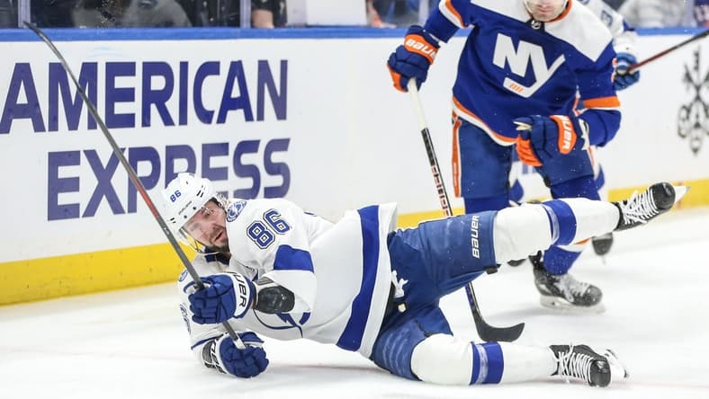Feb 24, 2024; Elmont, New York, USA; Tampa Bay Lightning right wing Nikita Kucherov (86) falls on the ice after a collision in the first period against the New York Islanders at UBS Arena. Mandatory Credit: Wendell Cruz-USA TODAY Sports