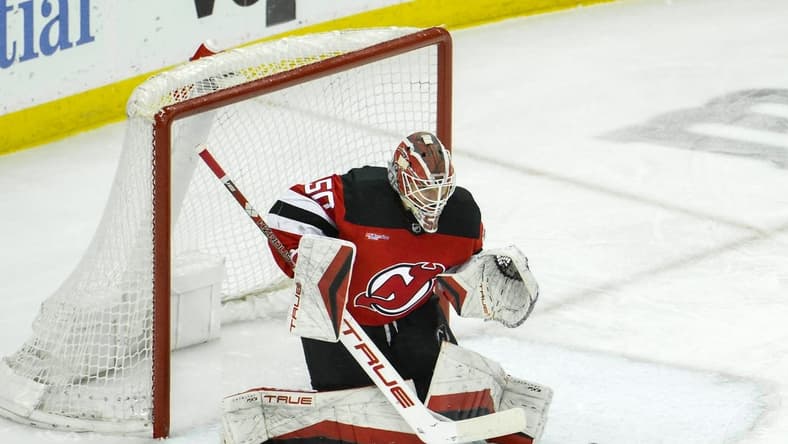 Feb 24, 2024; Newark, New Jersey, USA; New Jersey Devils goaltender Nico Daws (50) makes a save against the Montreal Canadiens during the third period at Prudential Center. Mandatory Credit: John Jones-USA TODAY Sports