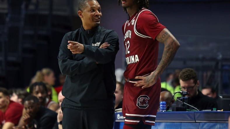 Feb 24, 2024; Oxford, Mississippi, USA; South Carolina Gamecocks head coach Lamont Paris (left) talks with guard Zachary Davis (12) during the second half against the Mississippi Rebels at The Sandy and John Black Pavilion at Ole Miss. Mandatory Credit: Petre Thomas-USA TODAY Sports