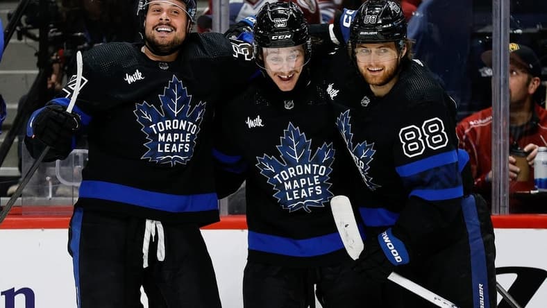 Feb 24, 2024; Denver, Colorado, USA; Toronto Maple Leafs left wing Tyler Bertuzzi (59) celebrates his hat trick goal with center Auston Matthews (34) and right wing William Nylander (88) in the third period against the Colorado Avalanche at Ball Arena. Mandatory Credit: Isaiah J. Downing-USA TODAY Sports