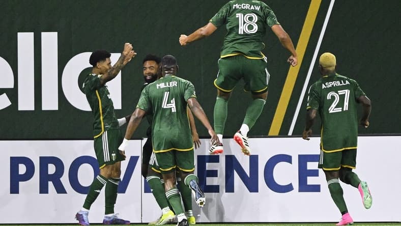 Feb 24, 2024; Portland, Oregon, USA; Portland Timbers forward Antony (11) celebrates with his teammates after scoring a goal against the Colorado Rapids at Providence Park. Mandatory Credit: Troy Wayrynen-USA TODAY Sports