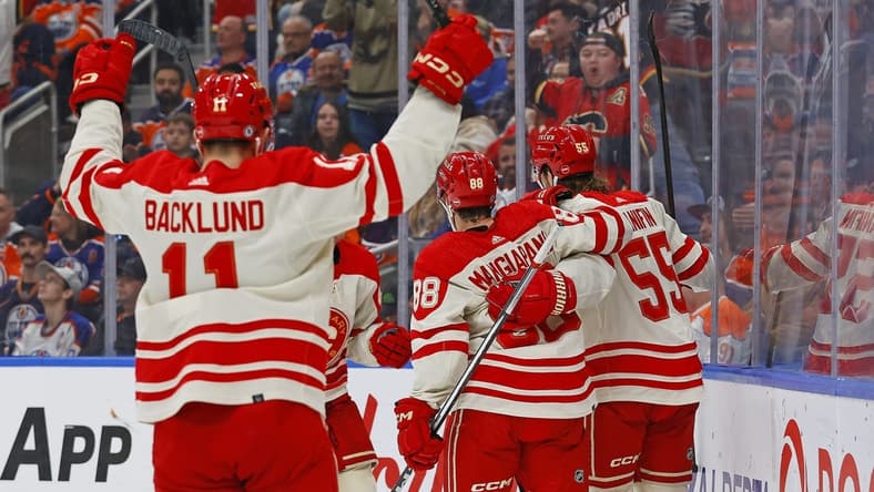 Feb 24, 2024; Edmonton, Alberta, CAN; The Calgary Flames celebrate a goal scored by defensemen Noah Hanifin (55) during the second period against the Edmonton Oilers at Rogers Place. Mandatory Credit: Perry Nelson-USA TODAY Sports