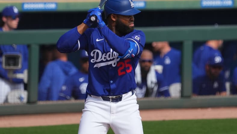 Feb 25, 2024; Phoenix, Arizona, USA; Los Angeles Dodgers designated hitter Manuel Margot (25) bats against the Oakland Athletics during the third inning at Camelback Ranch-Glendale. Mandatory Credit: Joe Camporeale-USA TODAY Sports