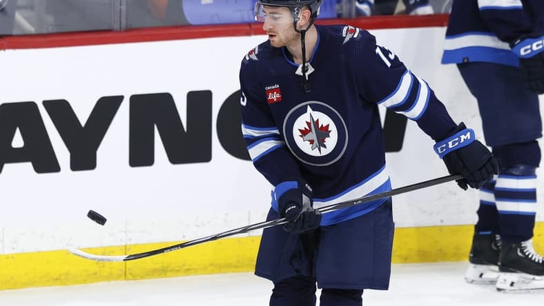 Feb 25, 2024; Winnipeg, Manitoba, CAN; Winnipeg Jets center Gabriel Vilardi (13) puck juggles before a game against the Arizona Coyotes at Canada Life Centre. Mandatory Credit: James Carey Lauder-USA TODAY Sports