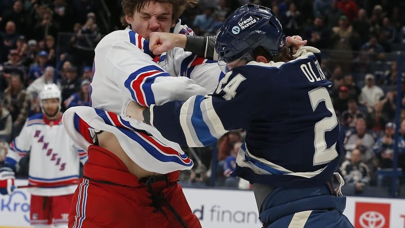 Feb 25, 2024; Columbus, Ohio, USA; Columbus Blue Jackets right wing Mathieu Olivier (24) and New York Rangers center Matt Rempe (73) fight during the first period at Nationwide Arena. Mandatory Credit: Russell LaBounty-USA TODAY Sports