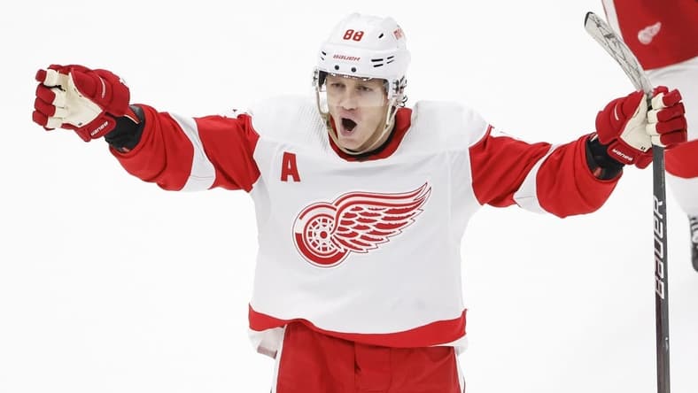 Feb 25, 2024; Chicago, Illinois, USA; Detroit Red Wings right wing Patrick Kane (88) celebrates after scoring game winning goal against the Chicago Blackhawks in overtime at United Center. Mandatory Credit: Kamil Krzaczynski-USA TODAY Sports