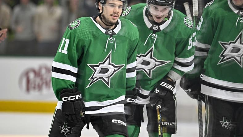 Feb 26, 2024; Dallas, Texas, USA; Dallas Stars center Logan Stankoven (11) and center Wyatt Johnston (53) skates off the ice after Stankoven scores his first career NHL goal during the second period against the New York Islanders at the American Airlines Center. Mandatory Credit: Jerome Miron-USA TODAY Sports
