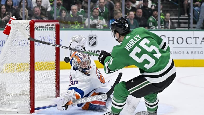 Feb 26, 2024; Dallas, Texas, USA; New York Islanders goaltender Ilya Sorokin (30) stops a breakaway shot by Dallas Stars defenseman Thomas Harley (55) during the second period at the American Airlines Center. Mandatory Credit: Jerome Miron-USA TODAY Sports