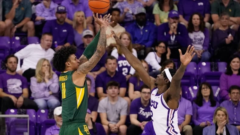 Feb 26, 2024; Fort Worth, Texas, USA; Baylor Bears forward Jalen Bridges (11) shoots over TCU Horned Frogs forward Emanuel Miller (2) during the first half at Ed and Rae Schollmaier Arena. Mandatory Credit: Raymond Carlin III-USA TODAY Sports
