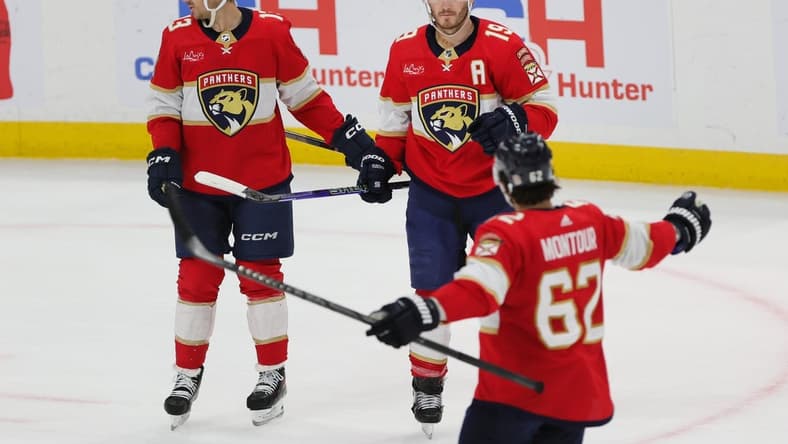 Feb 27, 2024; Sunrise, Florida, USA; Florida Panthers left wing Matthew Tkachuk (19) celebrates with center Sam Reinhart (13) and defenseman Brandon Montour (62) after scoring against the Buffalo Sabres during the first period at Amerant Bank Arena. Mandatory Credit: Sam Navarro-USA TODAY Sports