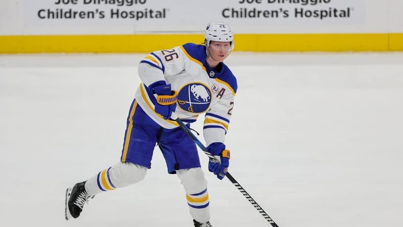 Feb 27, 2024; Sunrise, Florida, USA; Buffalo Sabres defenseman Rasmus Dahlin (26) moves the puck against the Florida Panthers during the first period at Amerant Bank Arena. Mandatory Credit: Sam Navarro-USA TODAY Sports
