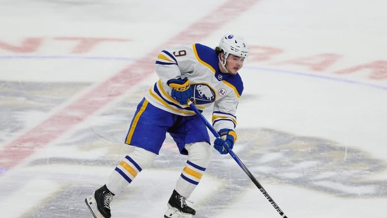 Feb 27, 2024; Sunrise, Florida, USA; Buffalo Sabres left wing Zach Benson (9) moves the puck against the Florida Panthers during the third period at Amerant Bank Arena. Mandatory Credit: Sam Navarro-USA TODAY Sports