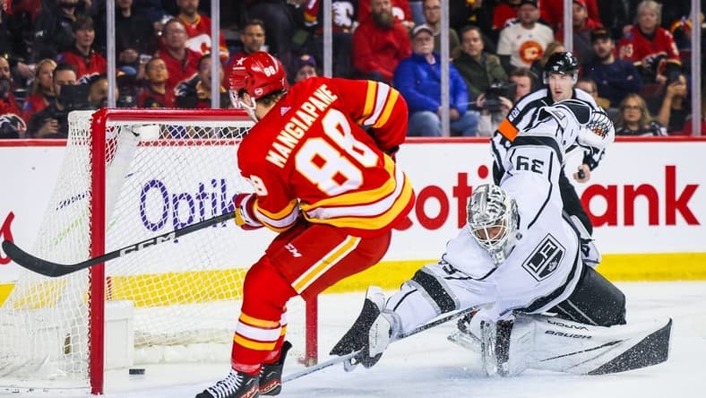 Feb 27, 2024; Calgary, Alberta, CAN; Calgary Flames left wing Andrew Mangiapane (88) scores a goal against Los Angeles Kings goaltender Cam Talbot (39) during the second period at Scotiabank Saddledome. Mandatory Credit: Sergei Belski-USA TODAY Sports