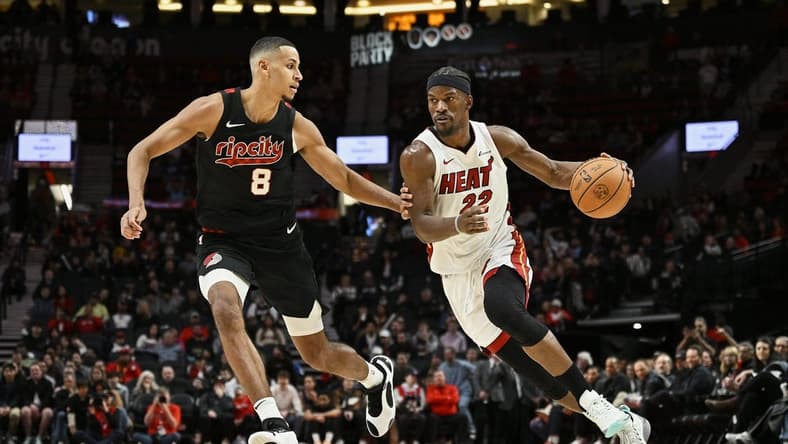 Feb 27, 2024; Portland, Oregon, USA; Miami Heat forward Jimmy Butler (22) drives to the basket during the second half against Portland Trail Blazers forward Kris Murray (8) at Moda Center. Mandatory Credit: Troy Wayrynen-USA TODAY Sports
