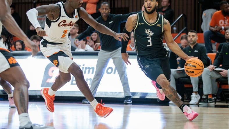 Feb 28, 2024; Stillwater, Oklahoma, USA; UCF Knights guard Darius Johnson (3) drives to the basket around Oklahoma State Cowboys forward Eric Dailey Jr. (2) during the first half at Gallagher-Iba Arena. Mandatory Credit: William Purnell-USA TODAY Sports